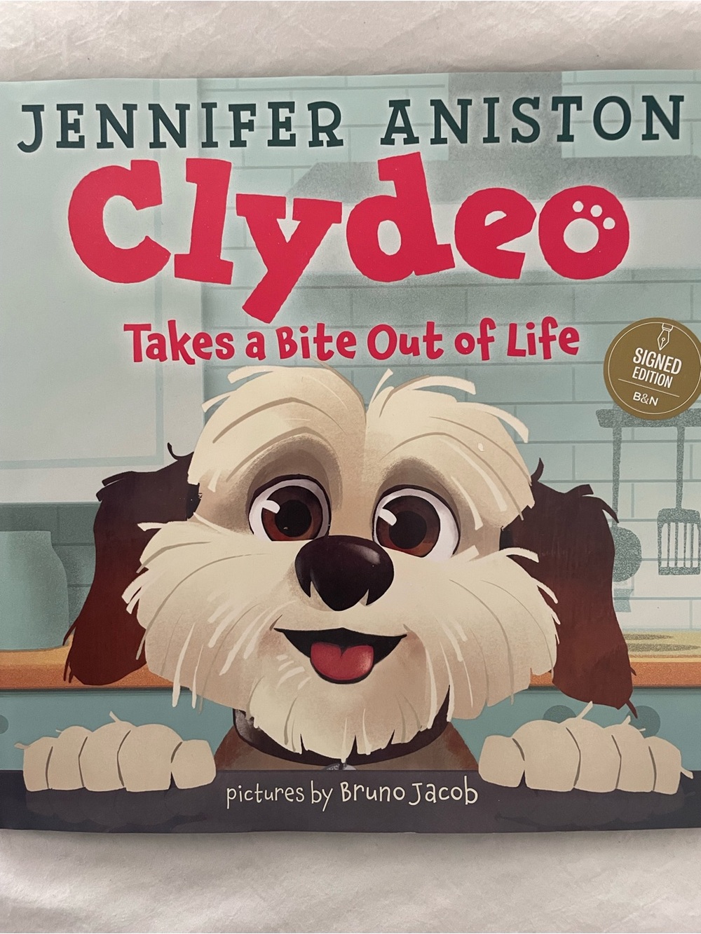 Clydeo Takes a Bite Out of Life- Autographed Jennifer Aniston book